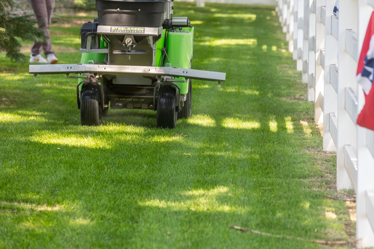 technician crew machine lawn fertilizer service yard detail