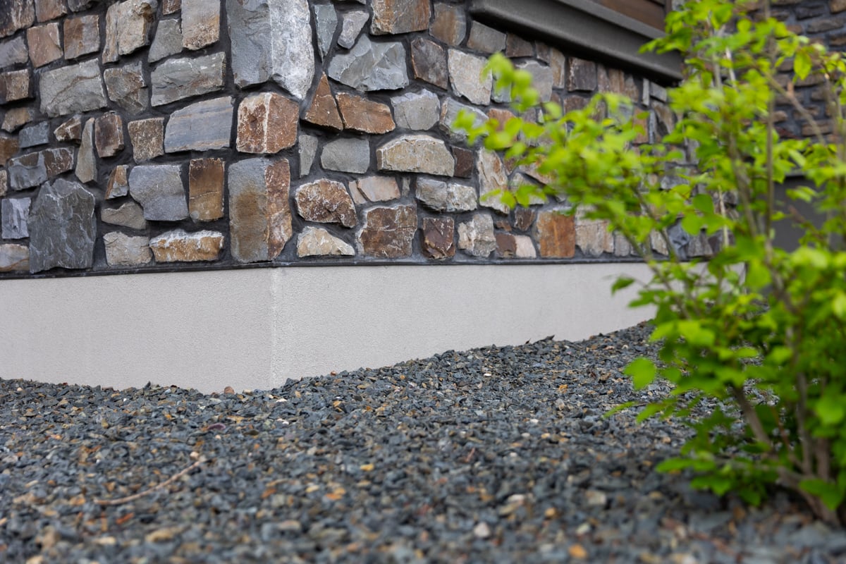 Gravel Bed Shrub Around Corner of House foundation