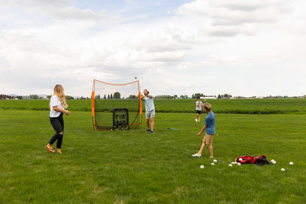 family enjoying a game on a nice lawn