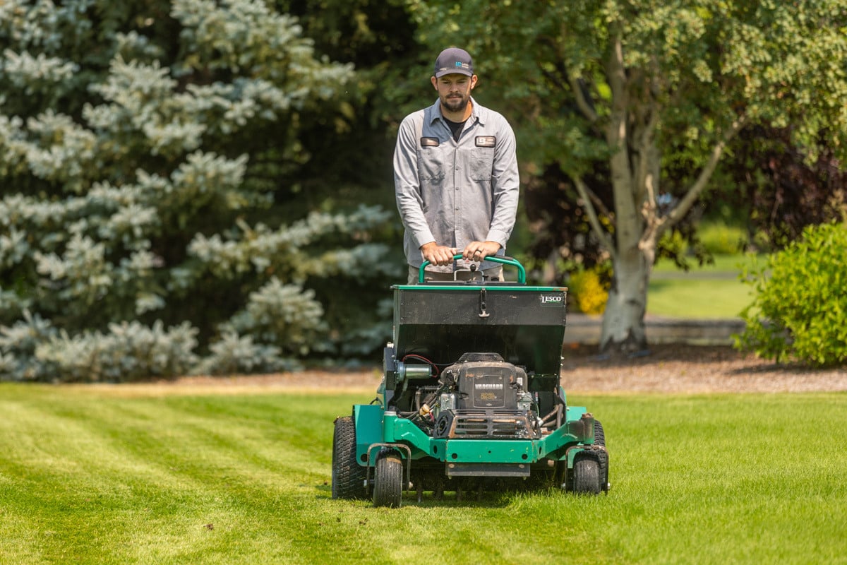 crew technician machine fertilizer green grass lawn turf lines action service 4